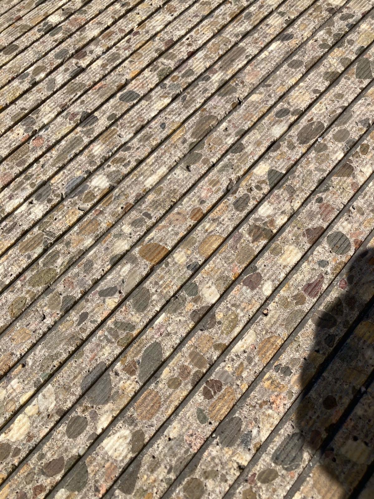 Close-up of grooved concrete road surface texture