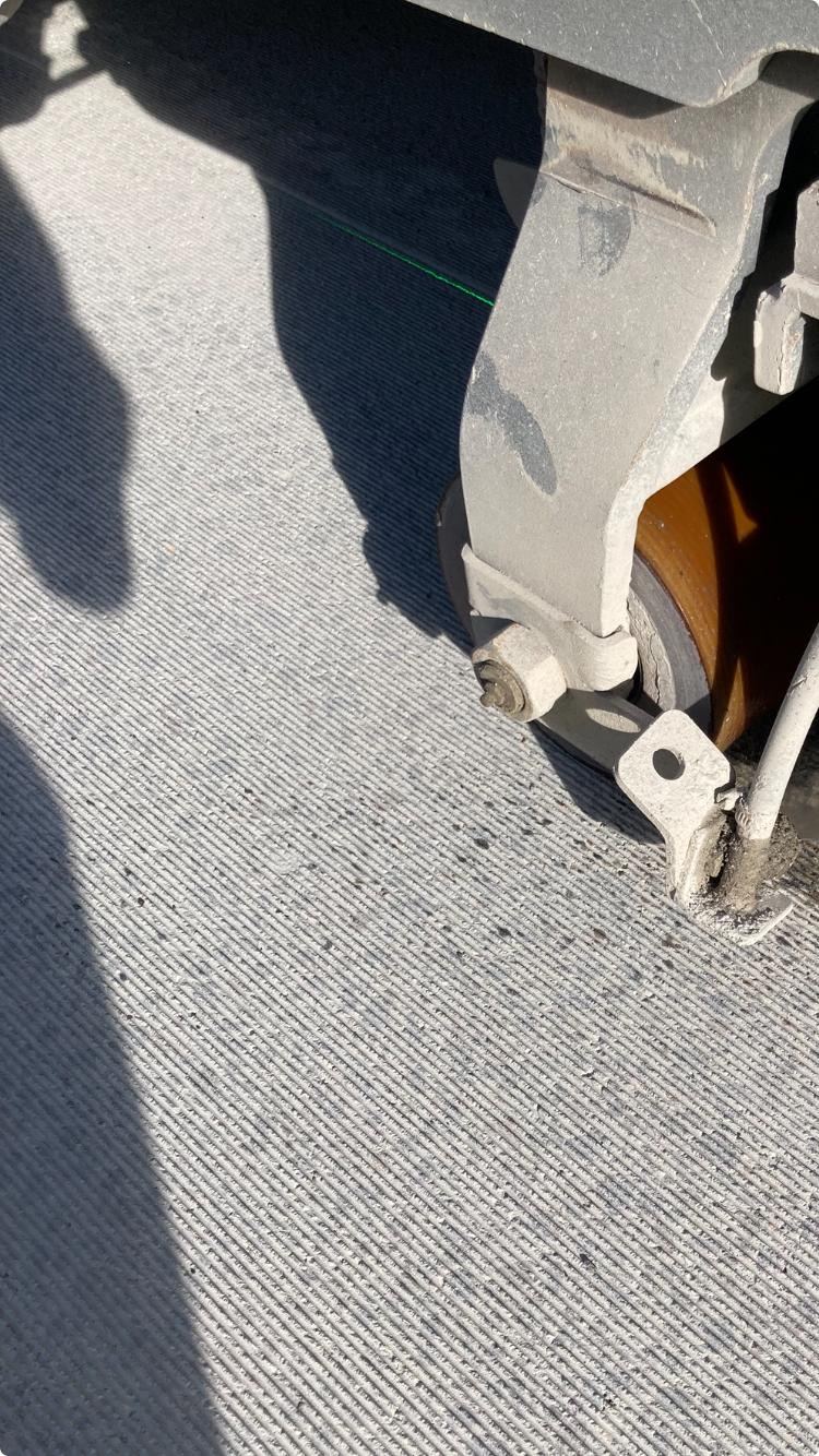 Laser-guided grooving machine on concrete road